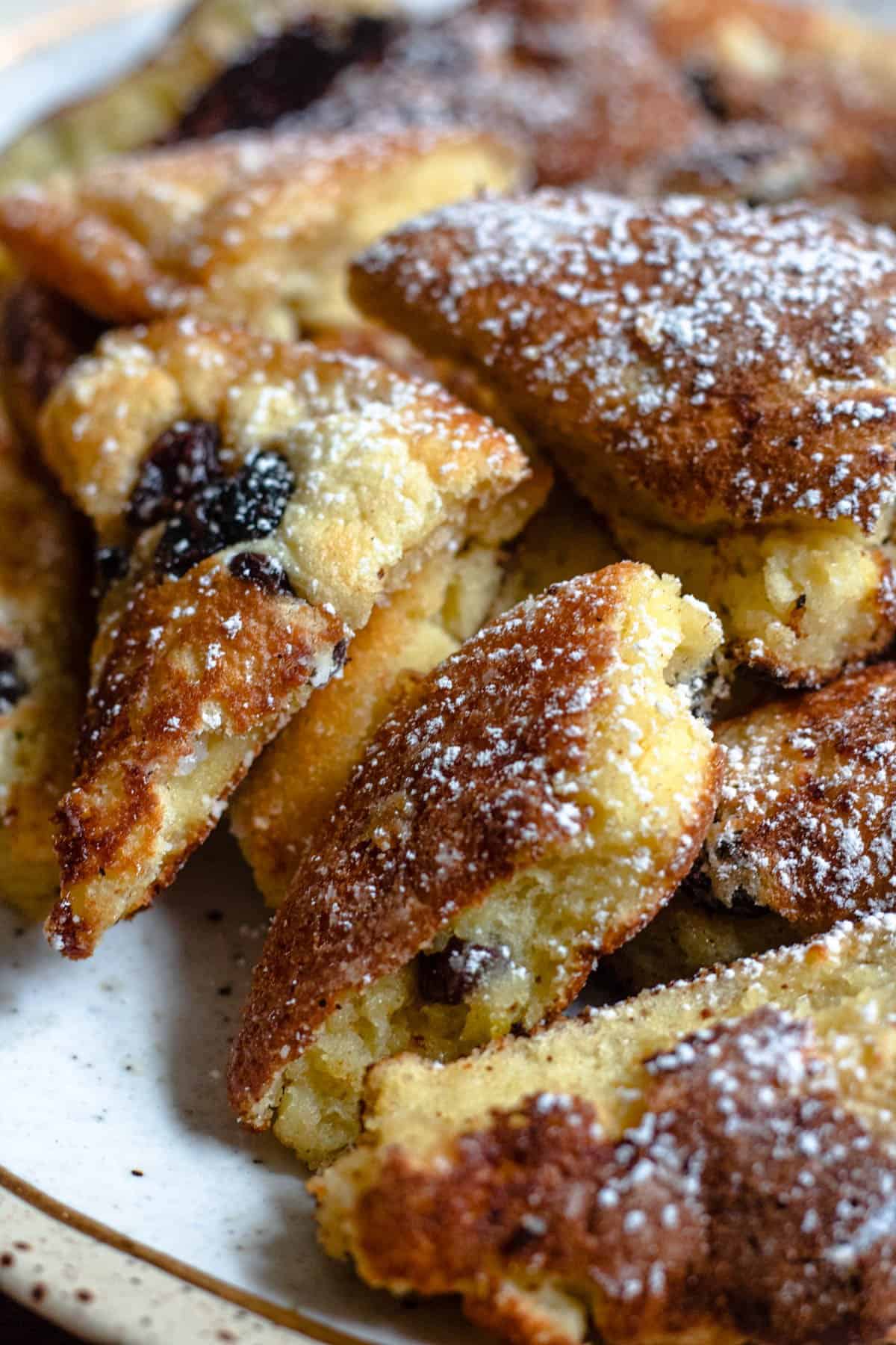 Close up of Kaiserschmarrn pieces sprinkled with powdered sugar. 