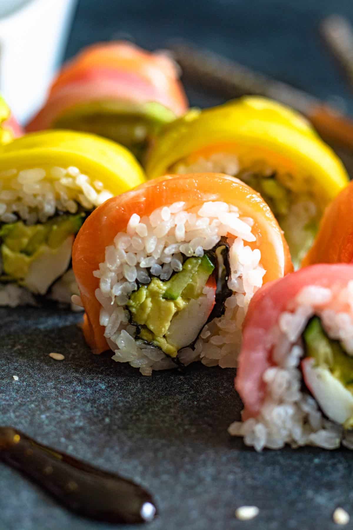 Sliced up rainbow sushi bites ready to serve. 