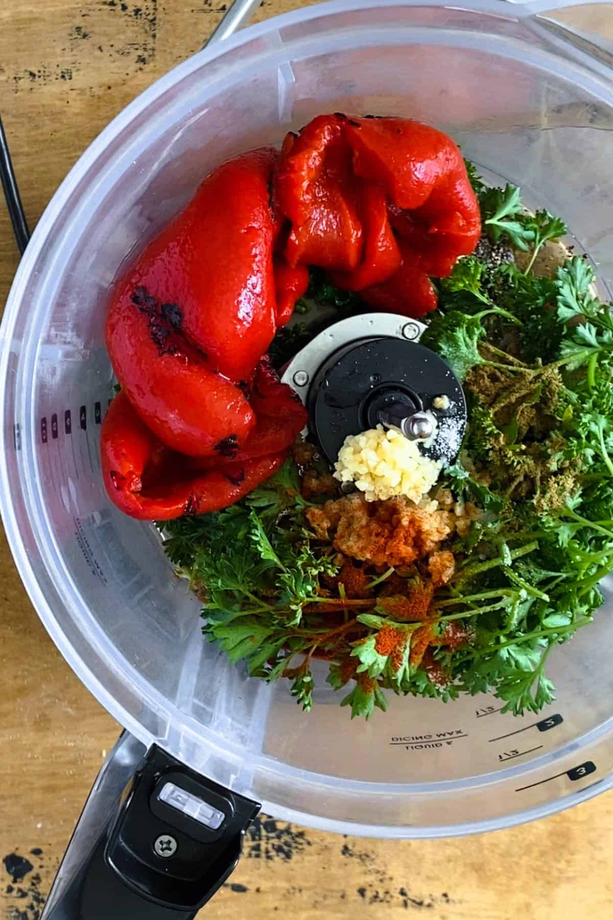 Ingredients for red chimichurri in a food processor. 