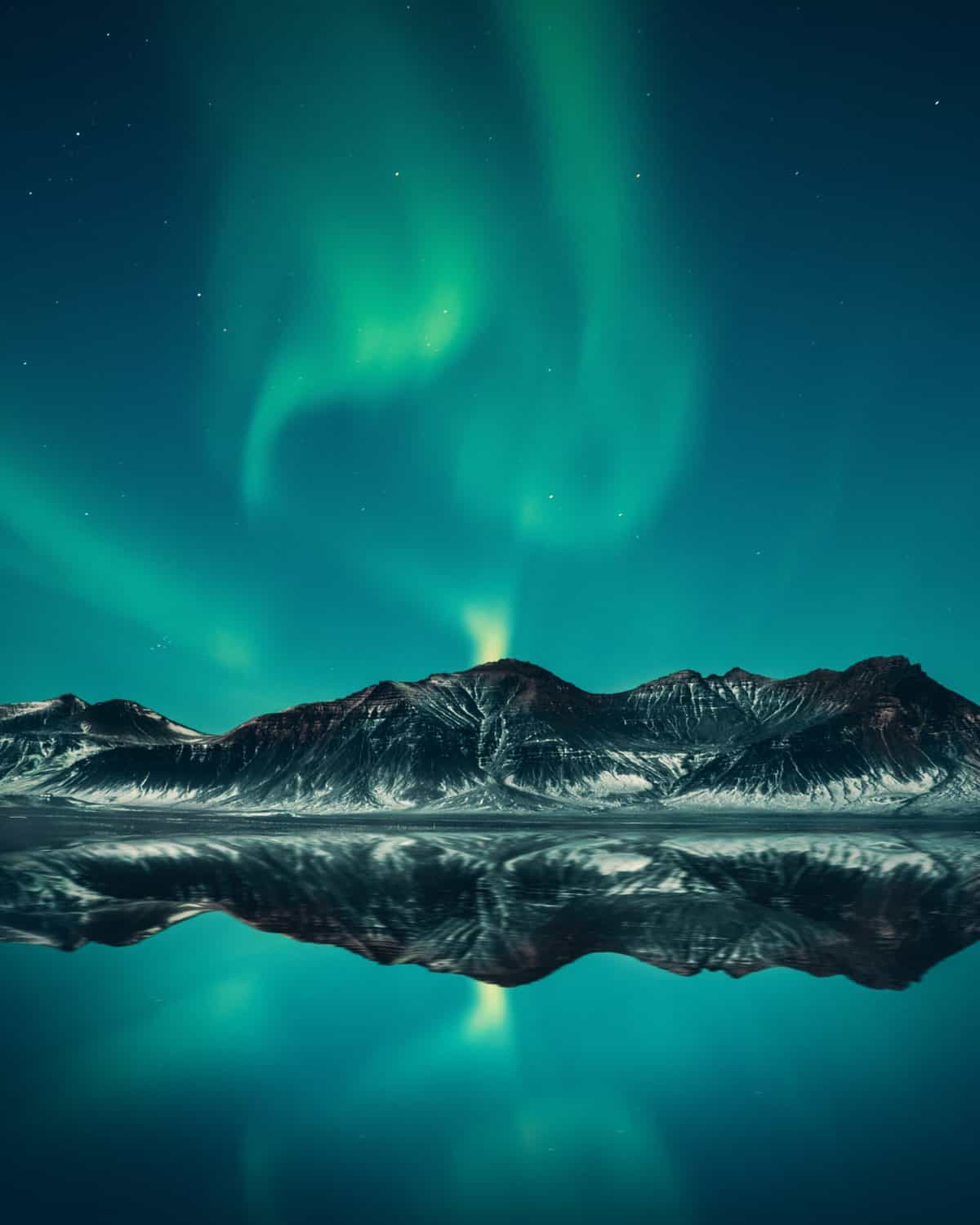 Mountain landscape showing the northern lights. 