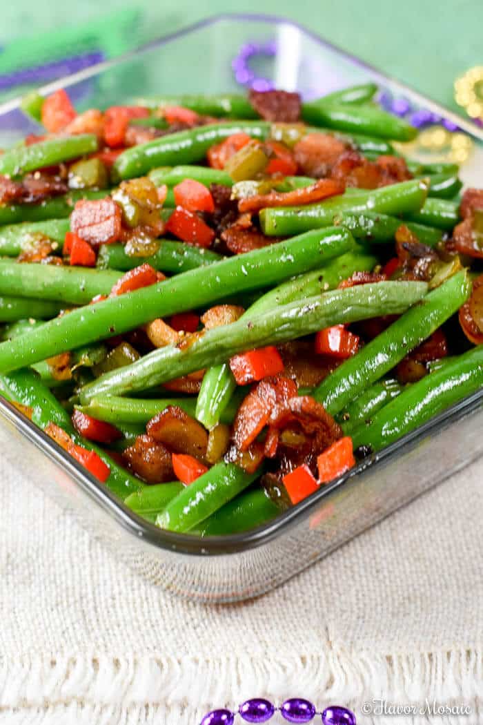 Creole green beans with bacon in a glass baking dish. 