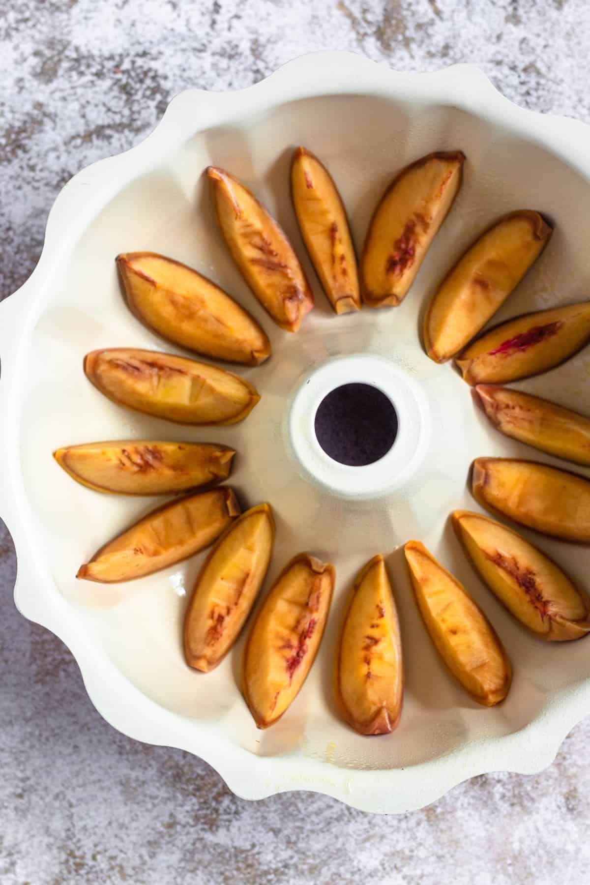 Fresh sliced peaches added to the bottom of the bundt pan. 