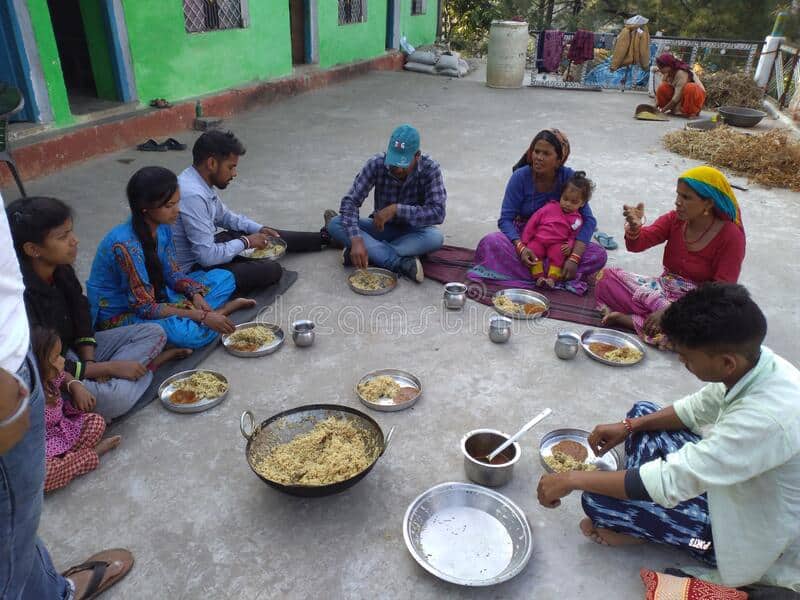 Indian family sitting on the floor eating their meal - Dreamstime.com