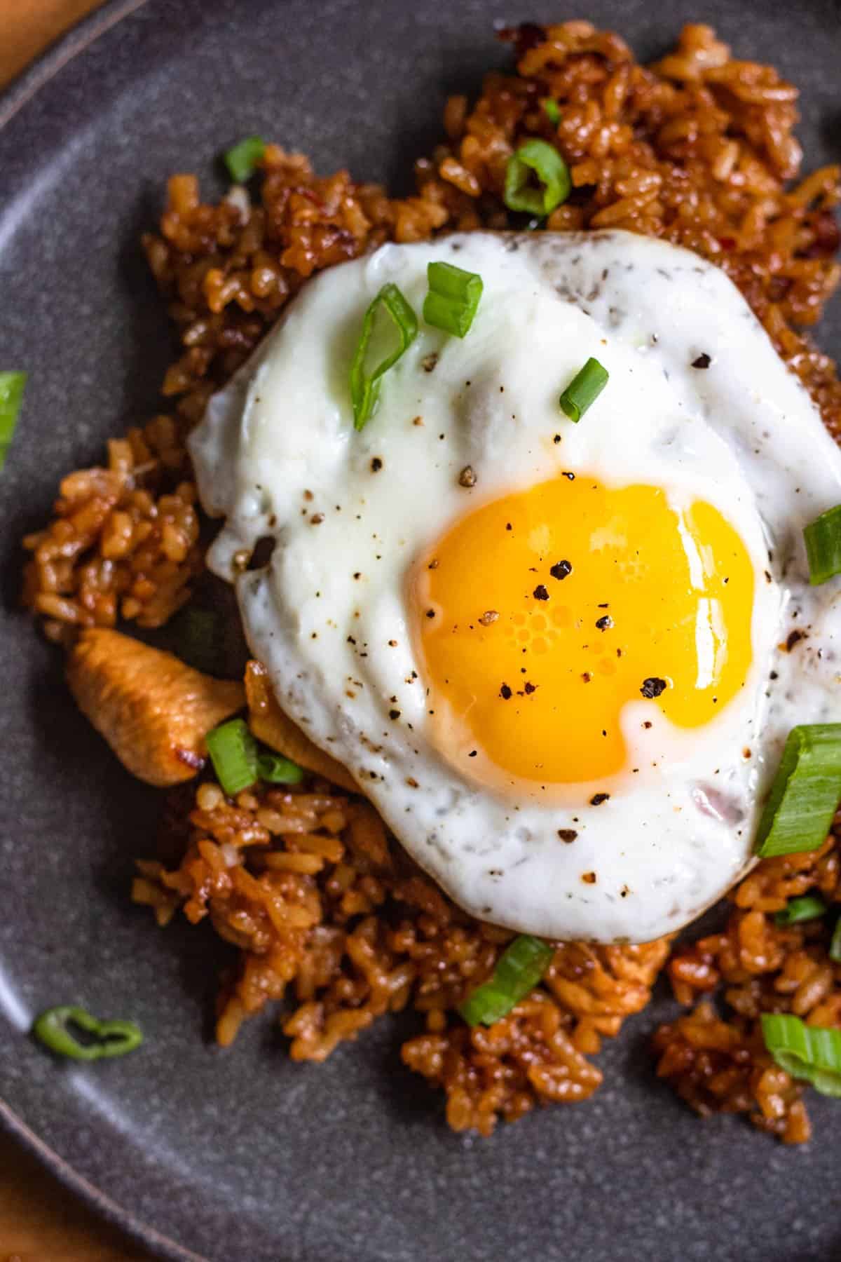 Close up of Nasi Goreng with a fried egg on top. 