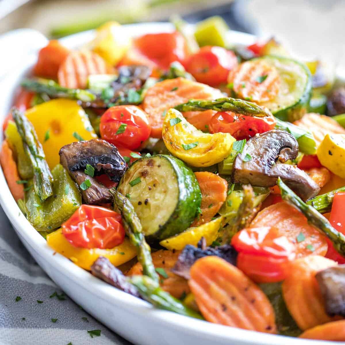 Colorful oven roasted vegetables in a serving bowl. 