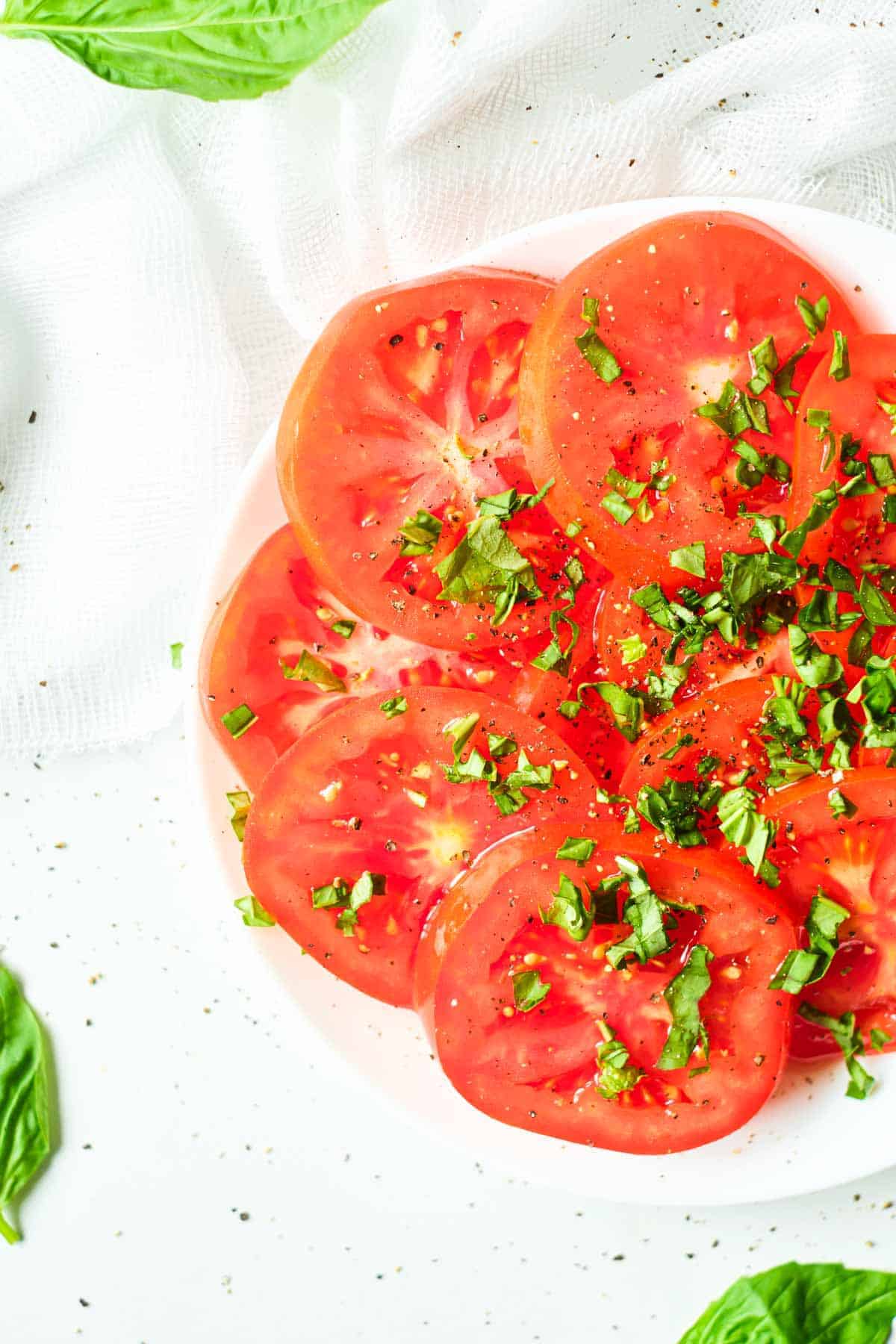 Marinated tomatoes with basil sprinkled over the top. 