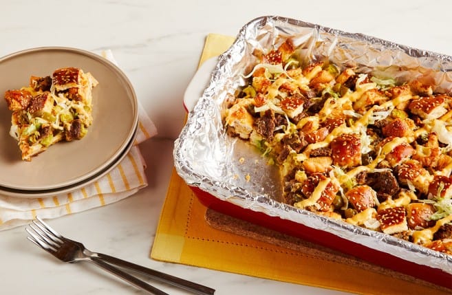 Aluminum foil lining a baking dish with a meal baked inside. 
