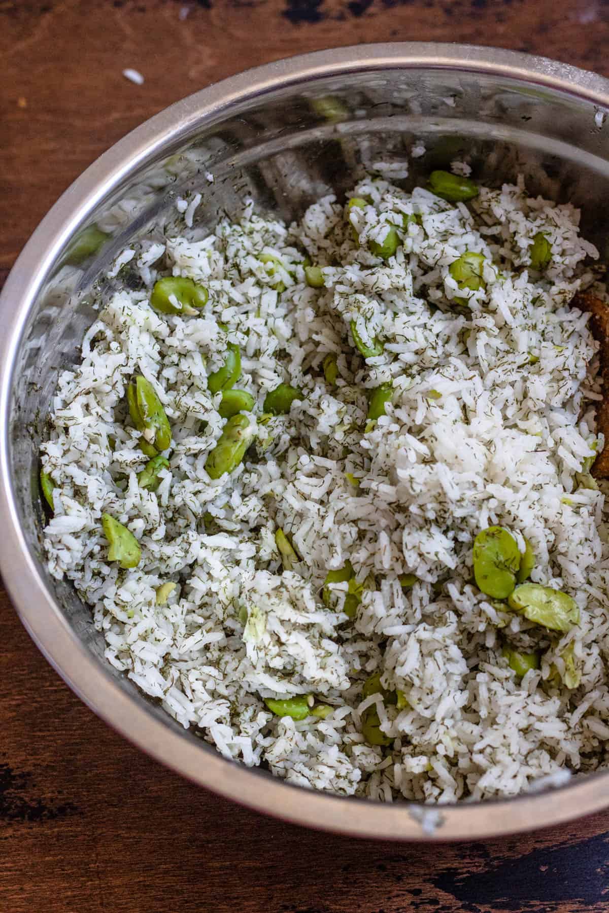 Basmati rice combined with fava beans and dried dill, the base for baghali polo. 