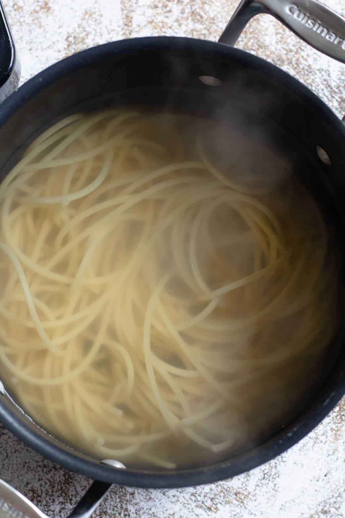 Bucatini in water, cooked to al dente. 