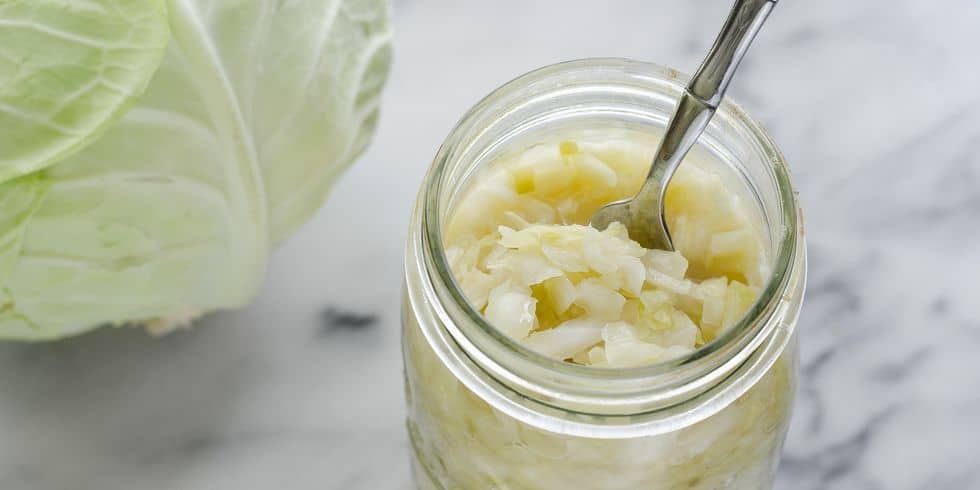 Small glass jar of homemade sauerkraut. 
