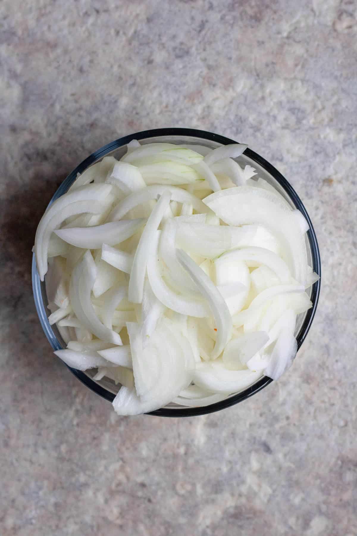 Bowl of sliced sweet onions. 