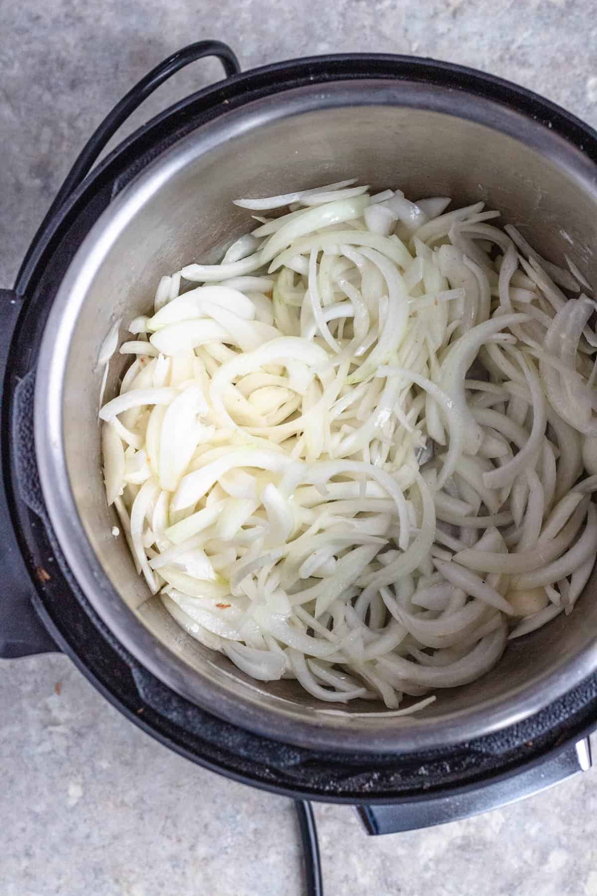 Sliced sweet onions in the Instant Pot. 