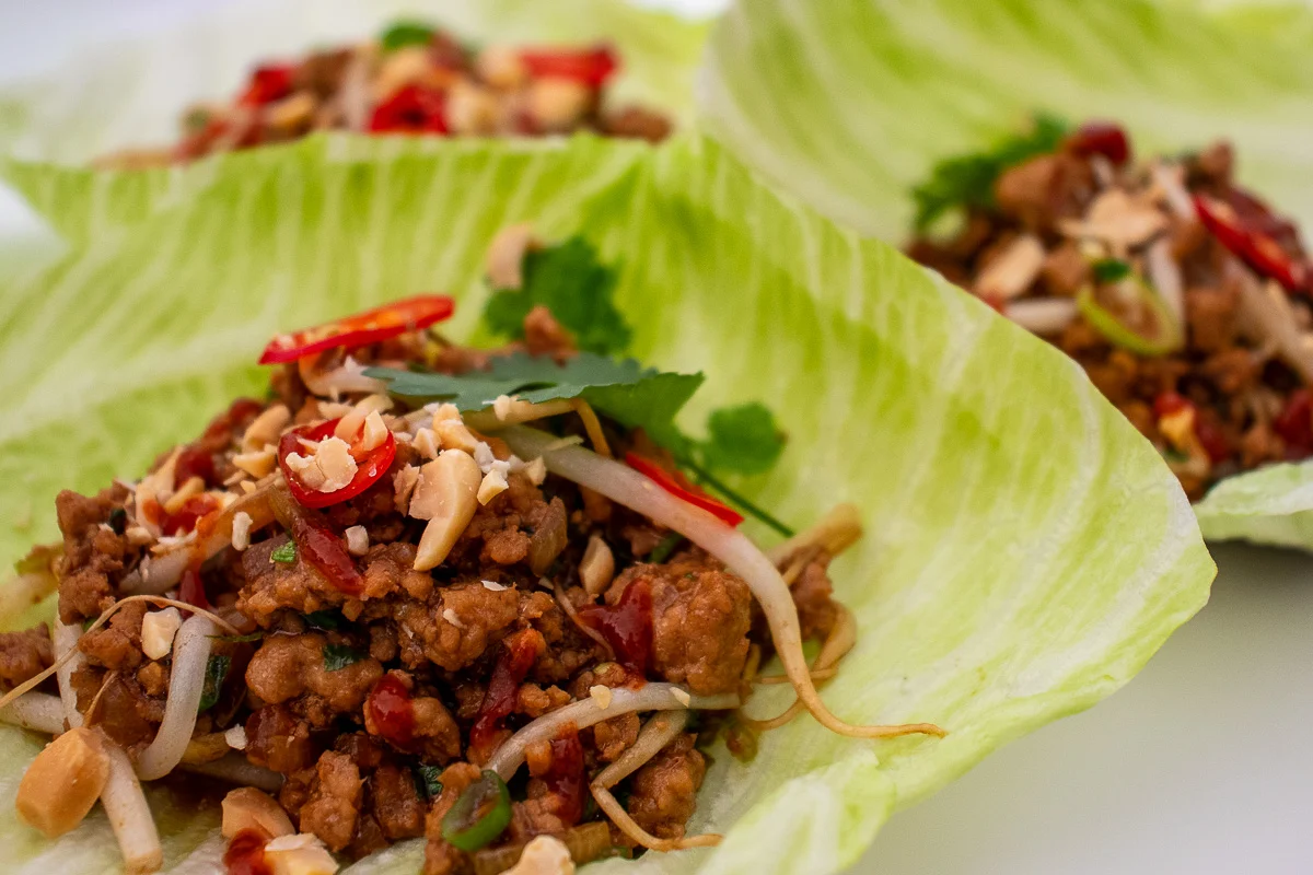Lettuce wrapped around a beef and veggie mixture - san choy bau. 