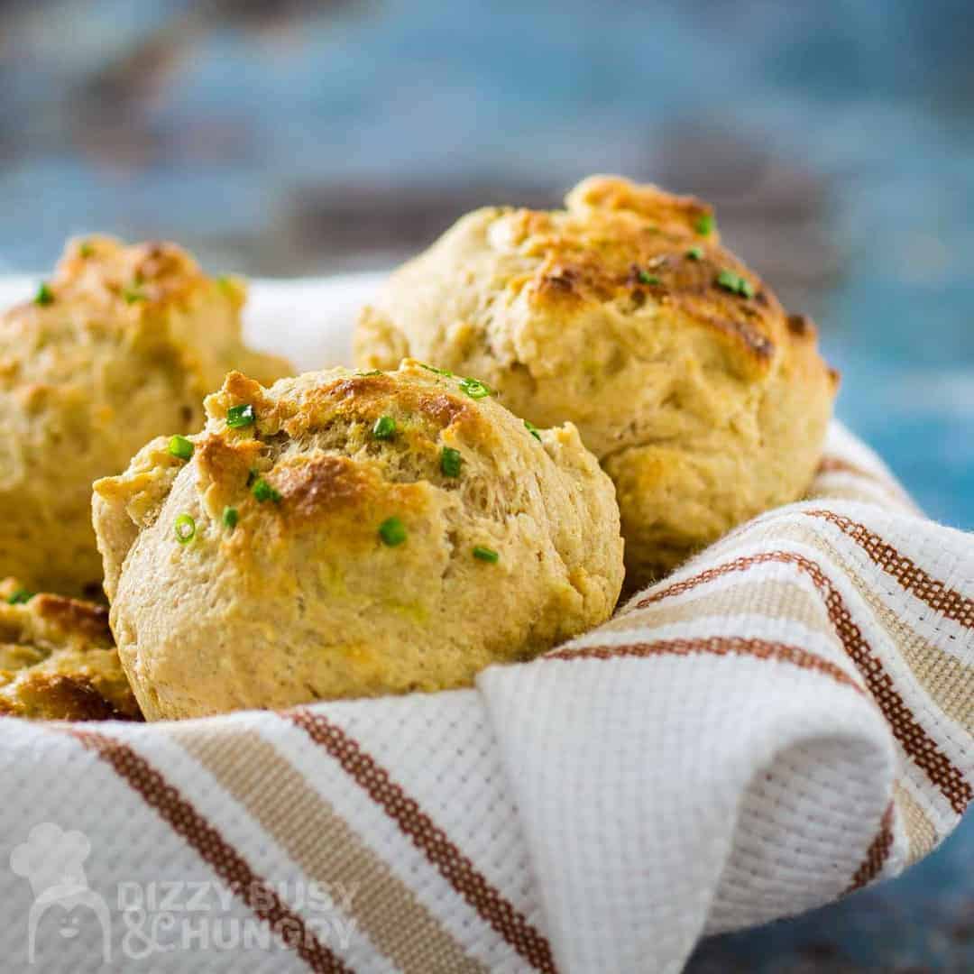 Easy drop biscuits laying on a towel in a basket ready to serve. 