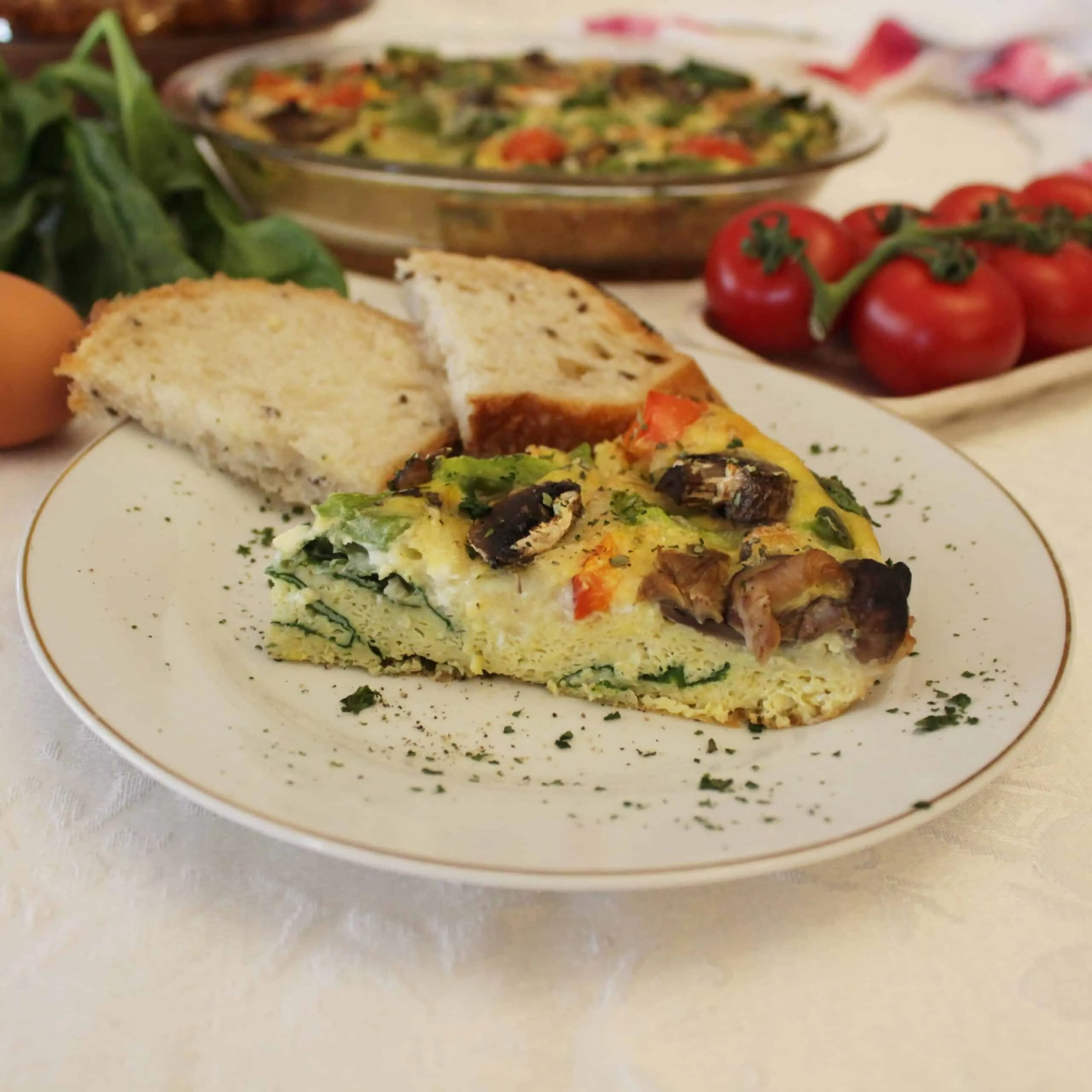 Slice of egg frittata on a plate. 