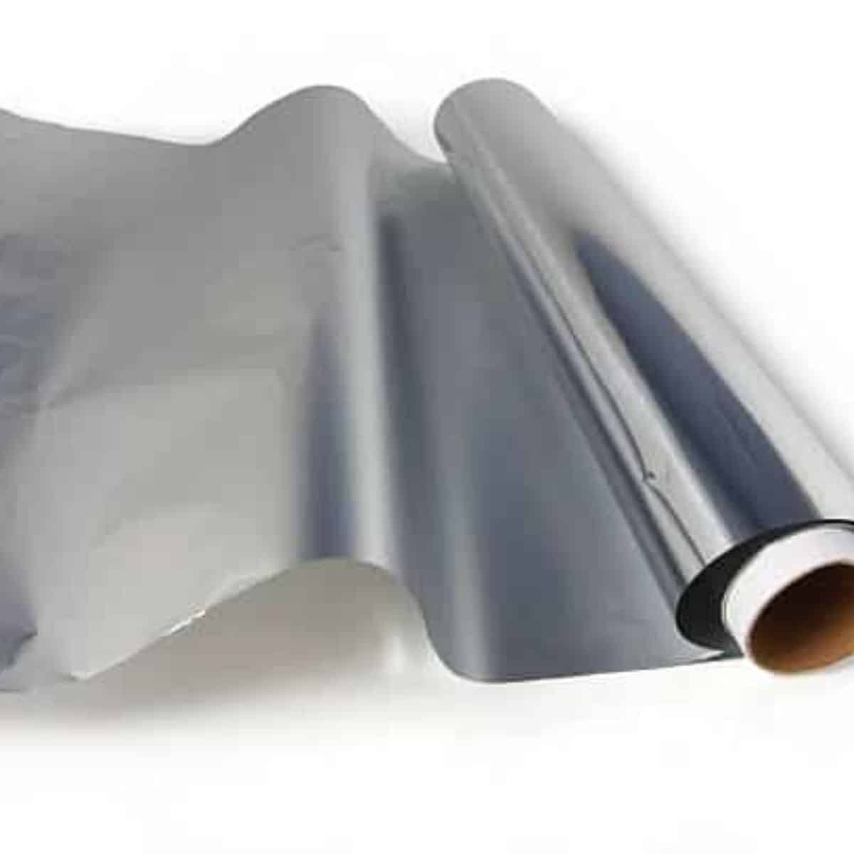 A roll of aluminum foil unrolling. 