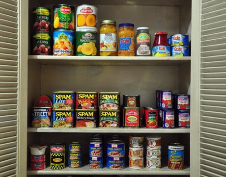 Shelf filled with canned goods.