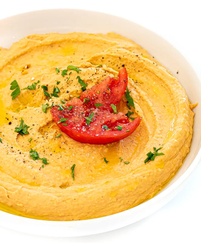 Roasted tomato hummus in a small bowl. 