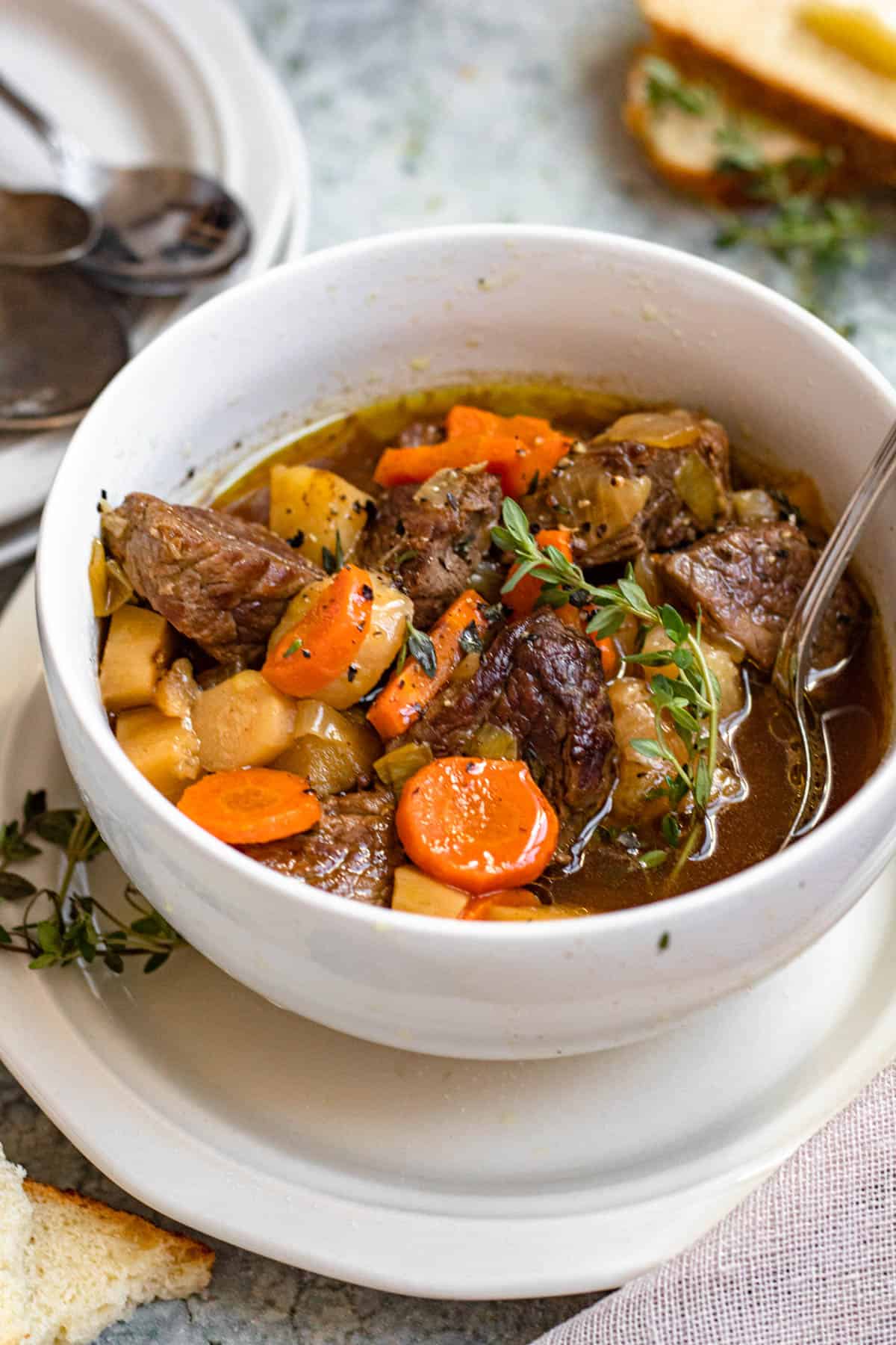 Bowl of Irish stew with a spoon inside 