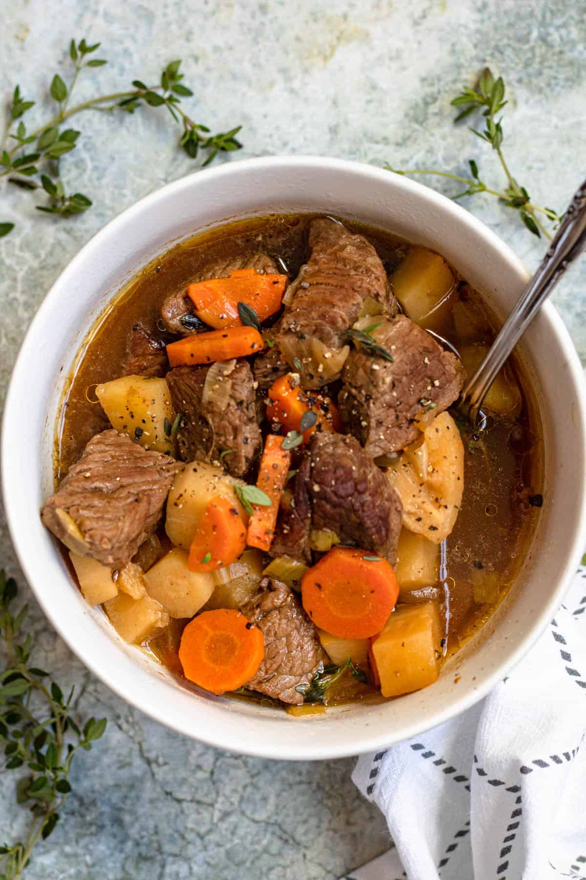 Bowl of Irish Stew recipe with a spoon laying in it. 