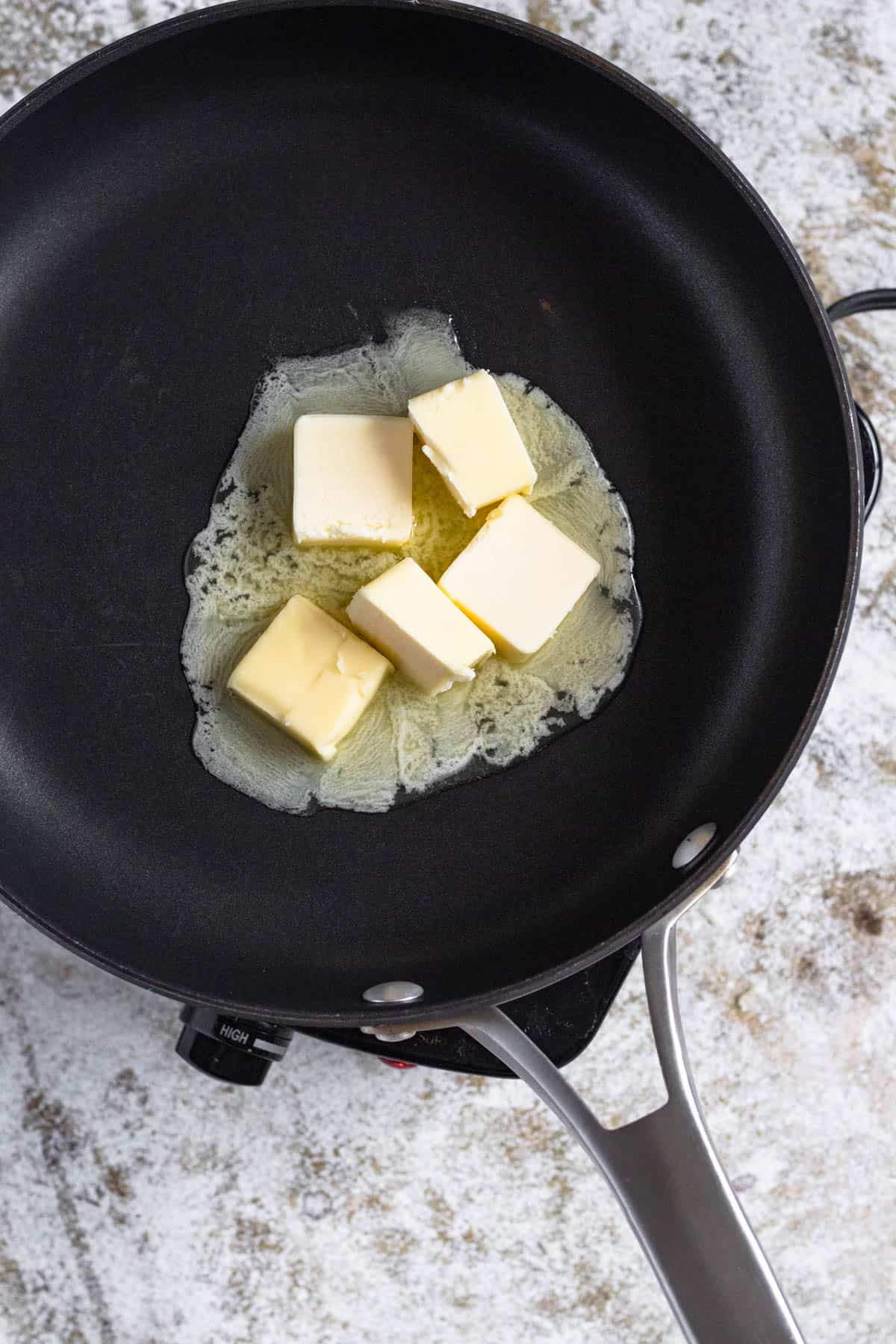 Butter melting in a frying pan. 