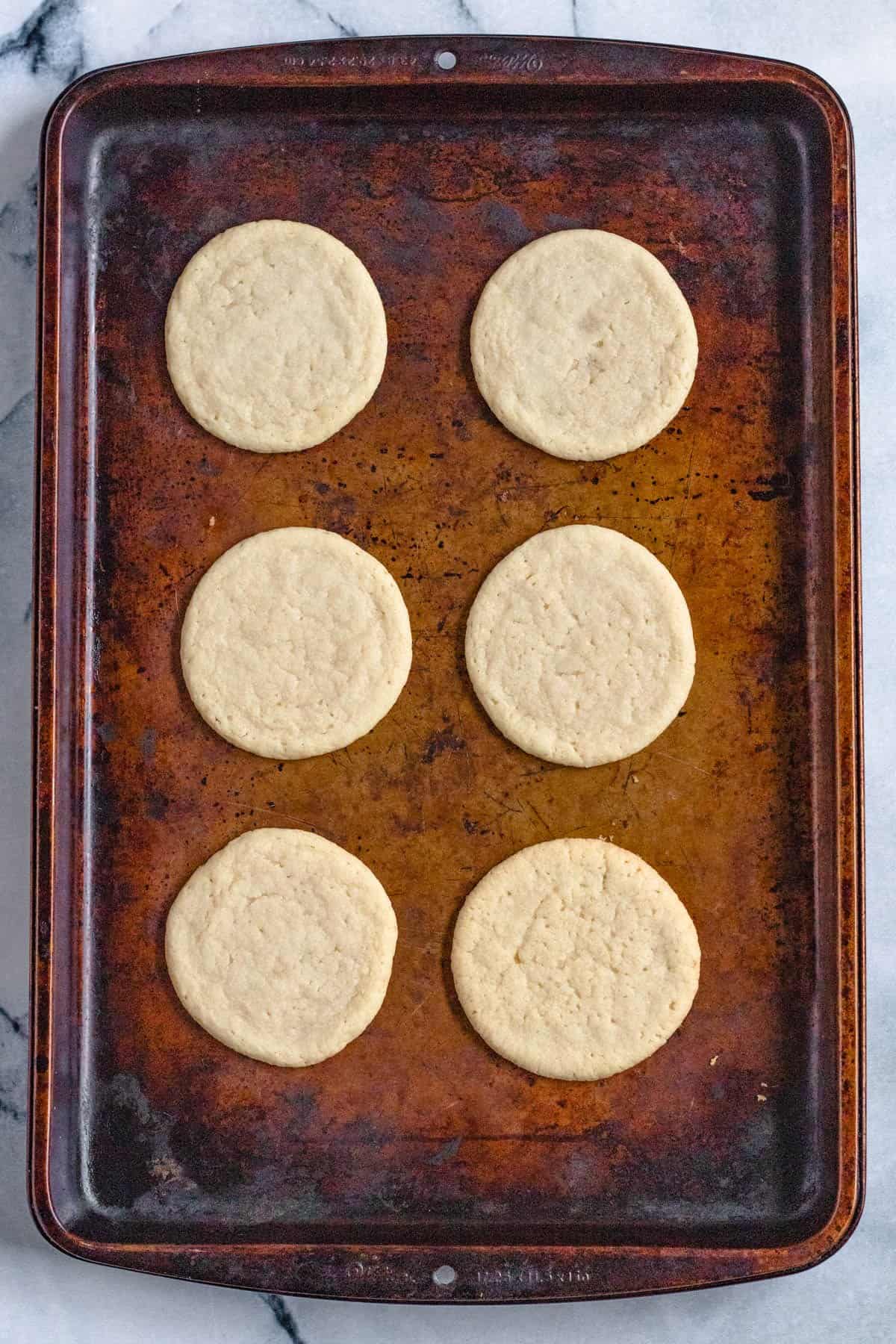Baked sugar cookies on a baking tray. 