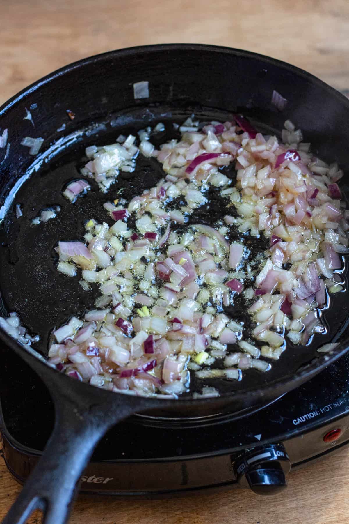 Onions sauteing in a skillet. 