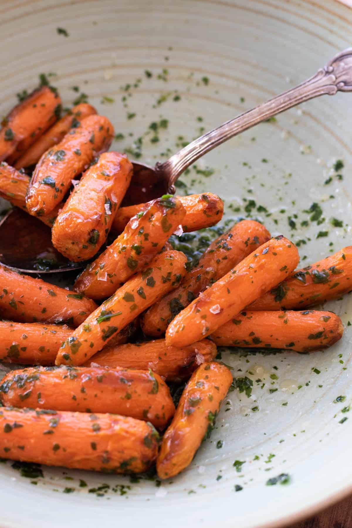 Air Fryer Baby Carrots with a serving spoon.