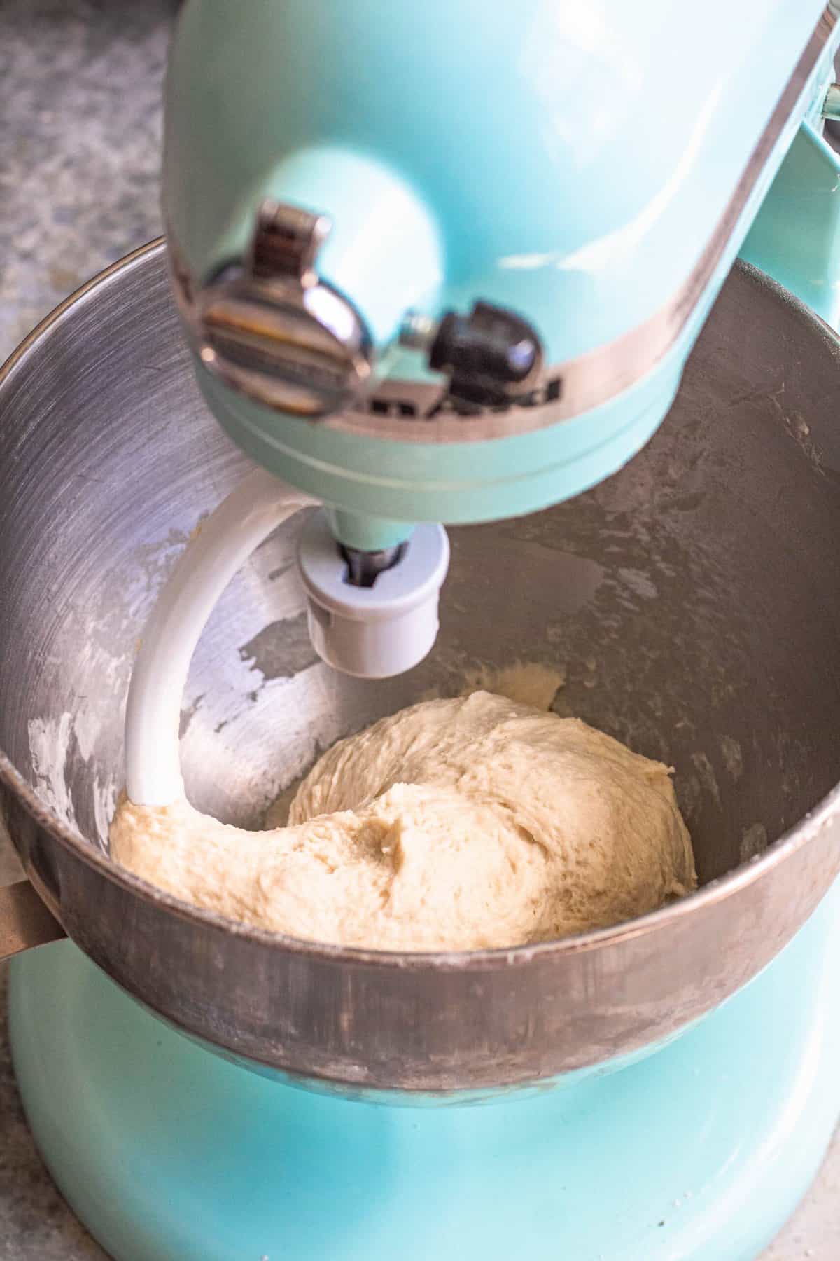 Kitchenaid kneading dough with the bread hook to make khachapuri. 
