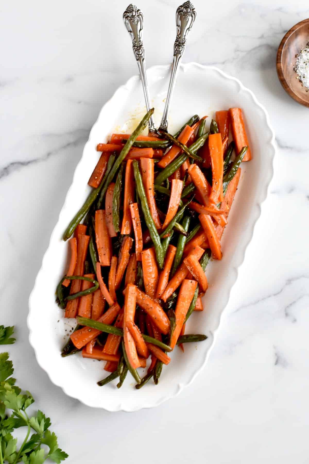 Rectangular serving dish with Hot Honey Carrots and Green Beans. 