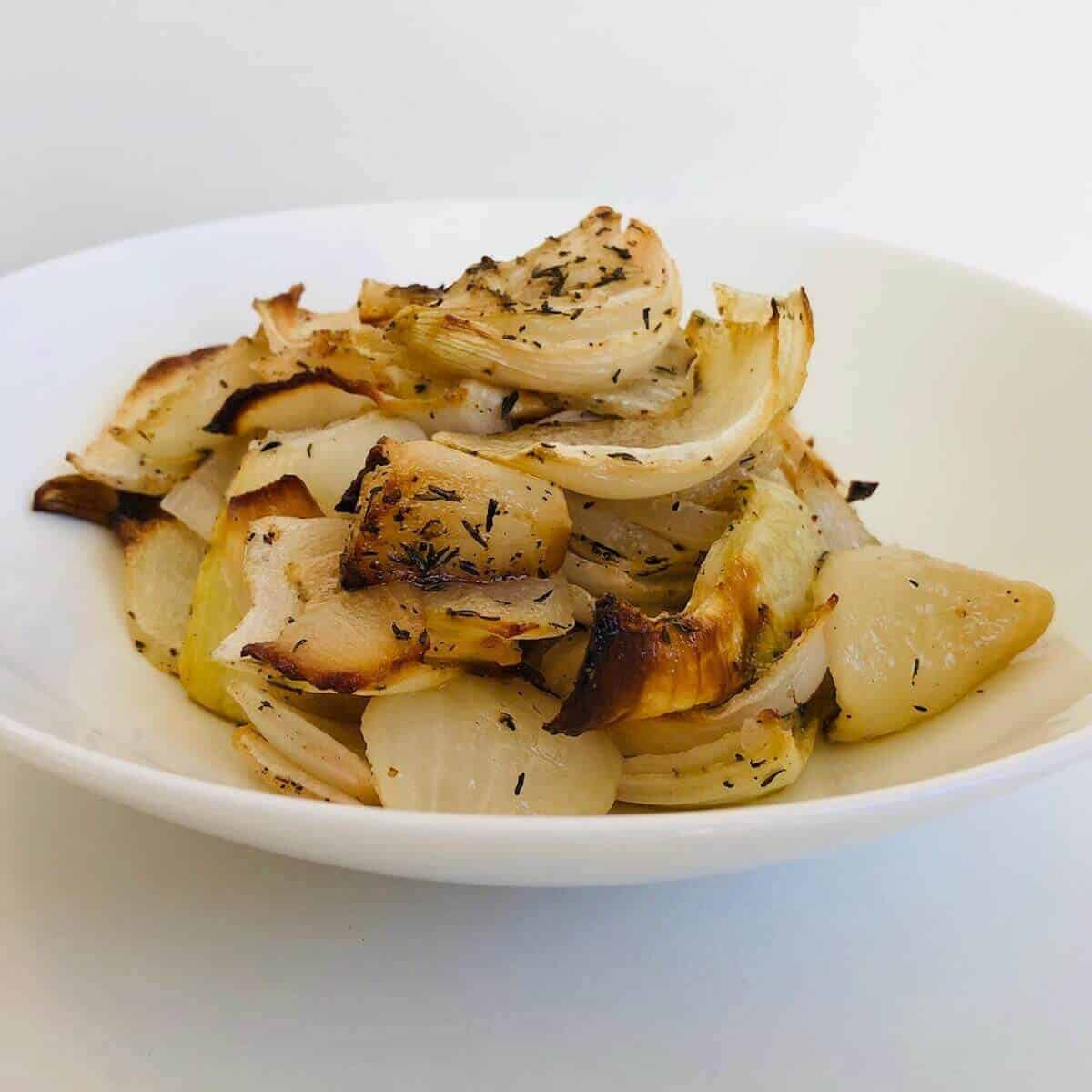 Roasted onions in a bowl. 