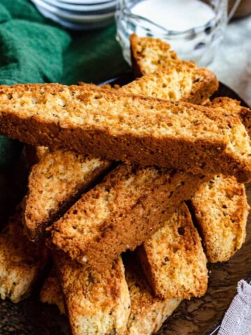 Biscotti in a pile on an oval platter.