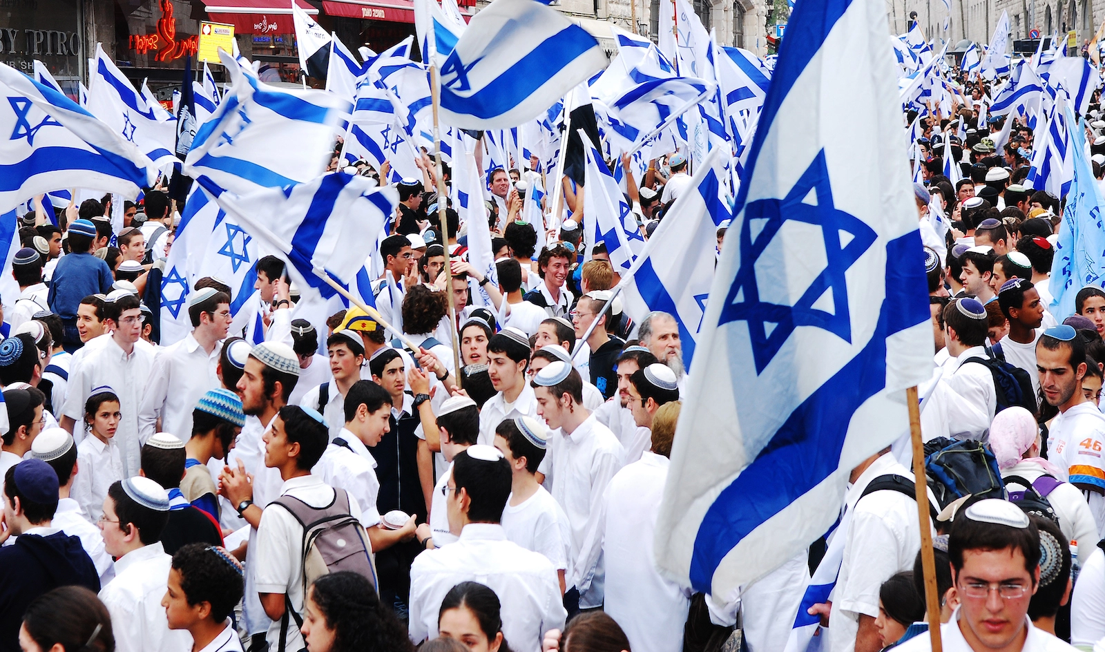 Young Israelians holding their country flags. 