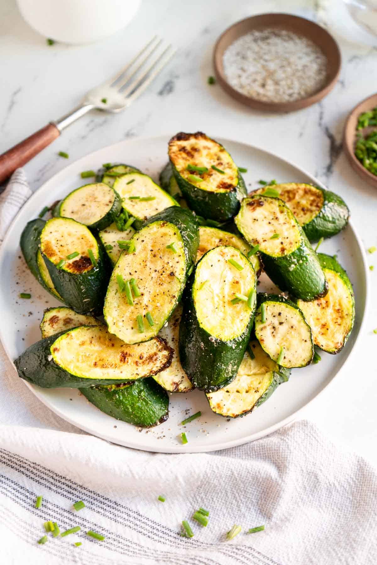 Roasted zucchini slices on a plate. 