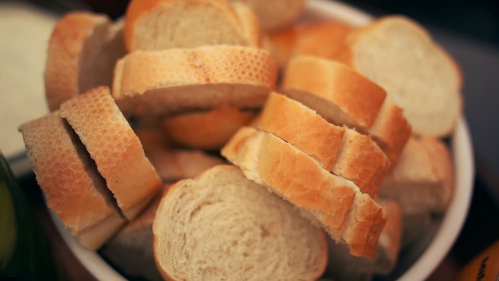 Slices of french bread in a bowl. 