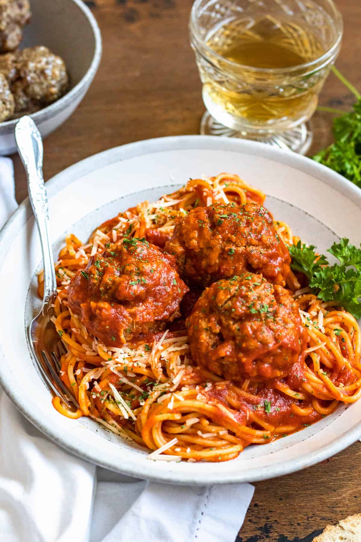 Spaghetti, sauce and soft meatballs recipe on a plate. 