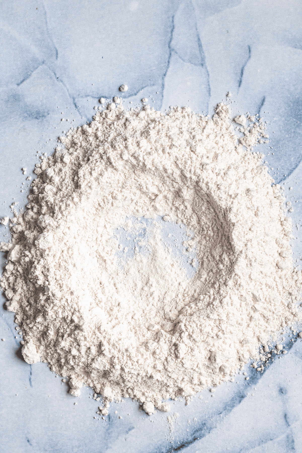 A pile of flour with a well in the middle.