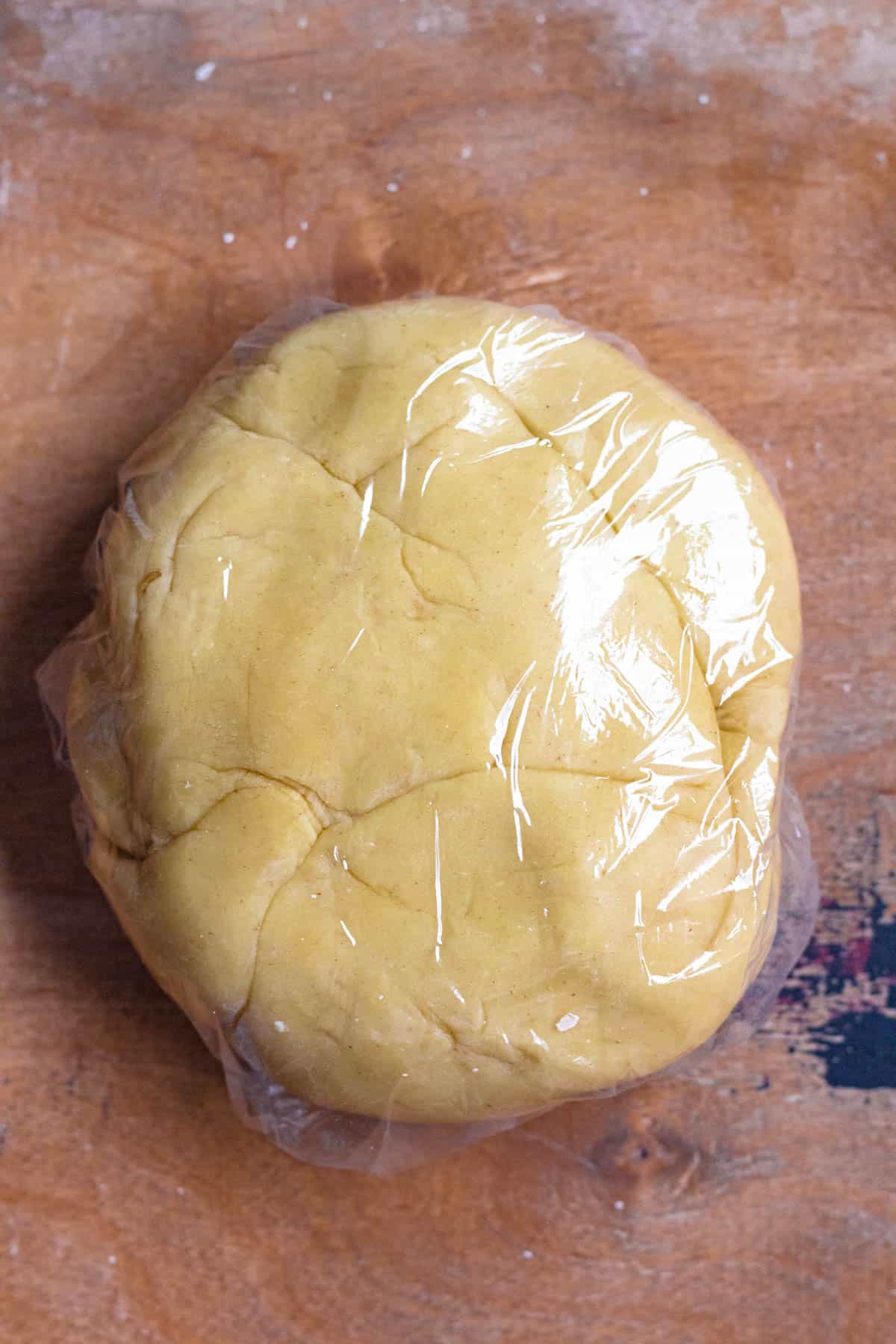 Pasta ravioli dough wrapped in plastic wrap. 