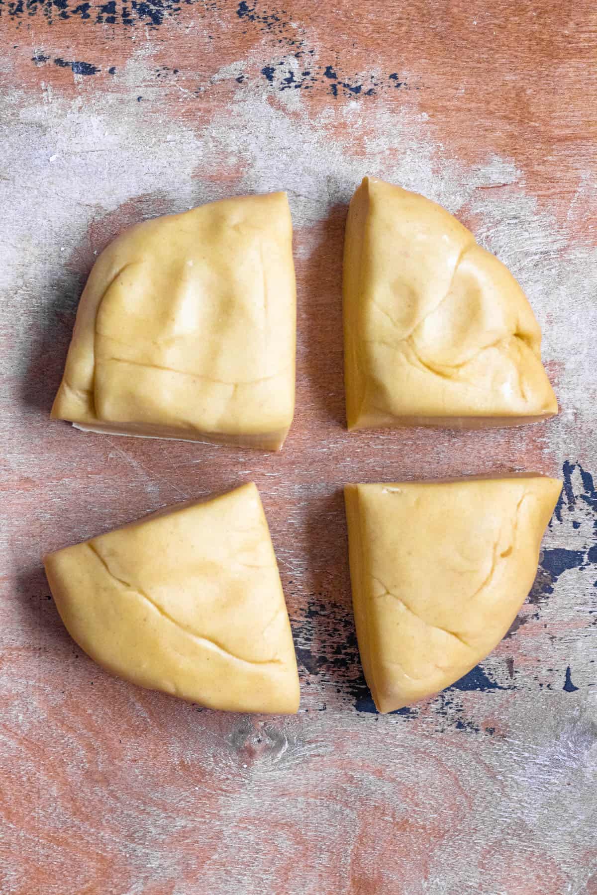 Ravioli pasta dough cut into 4 pieces. 