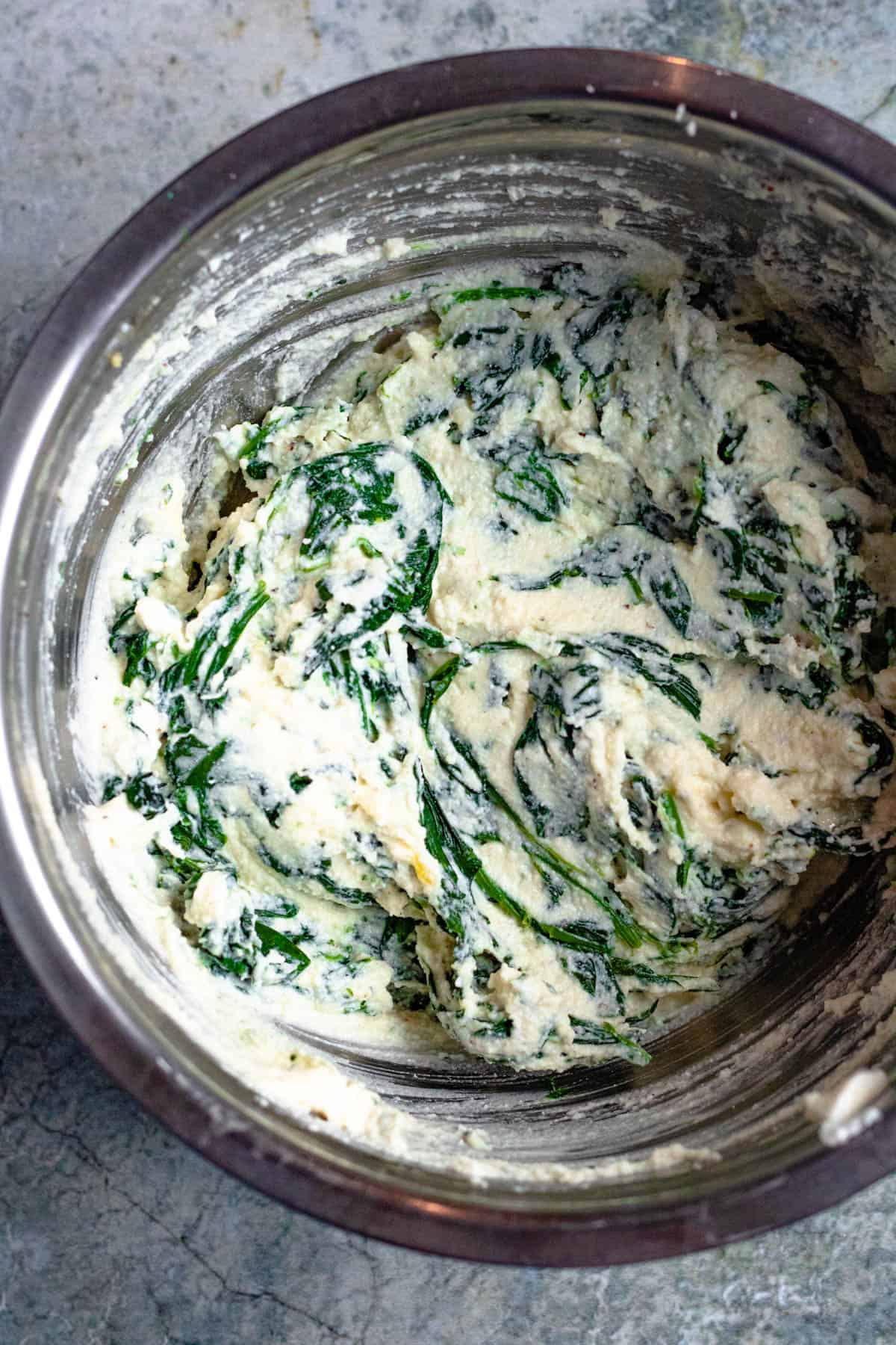 Creamy ravioli spinach  filling in a bowl. 