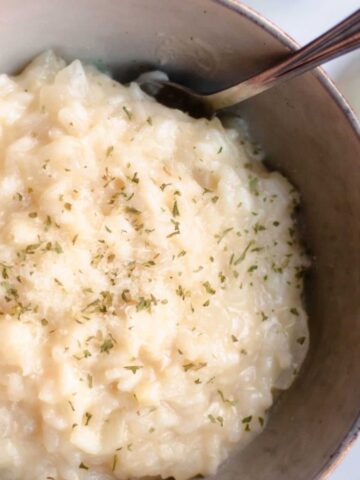 Parmesan risotto in a small bowl.