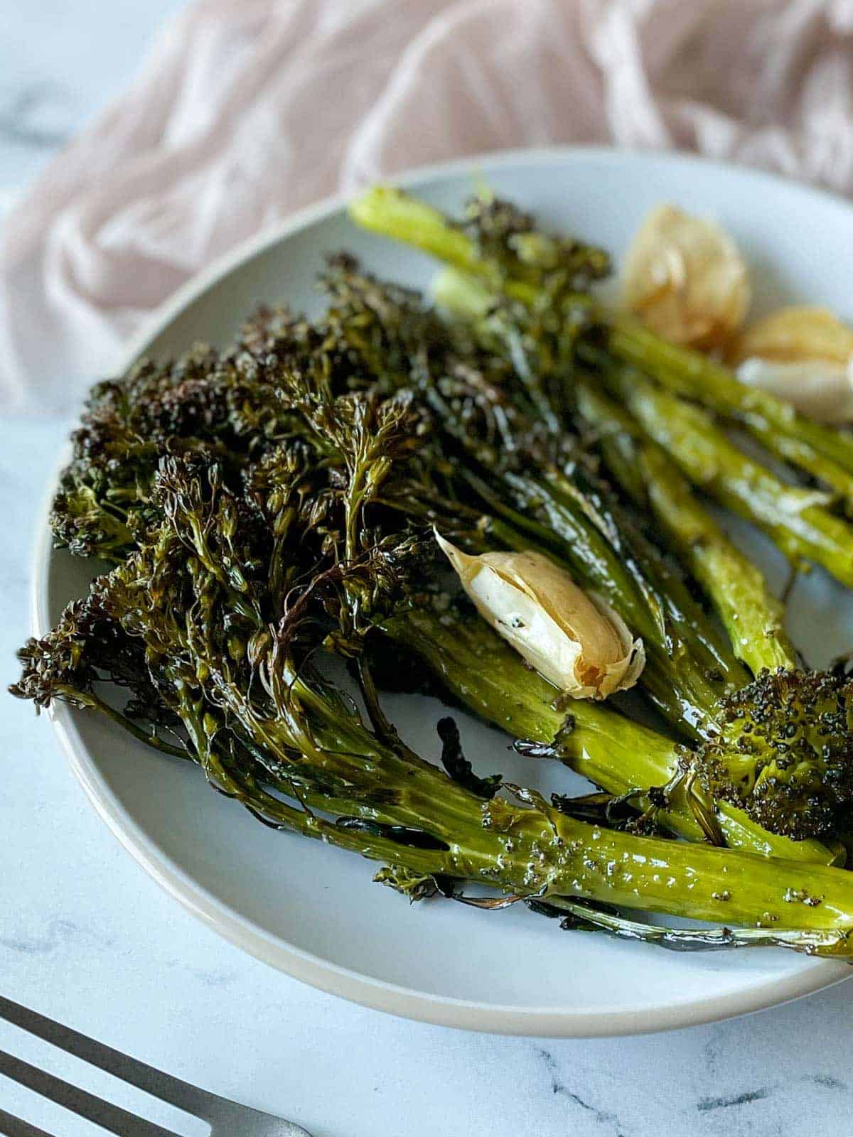 Roasted tenderstem broccoli on a serving platter. 