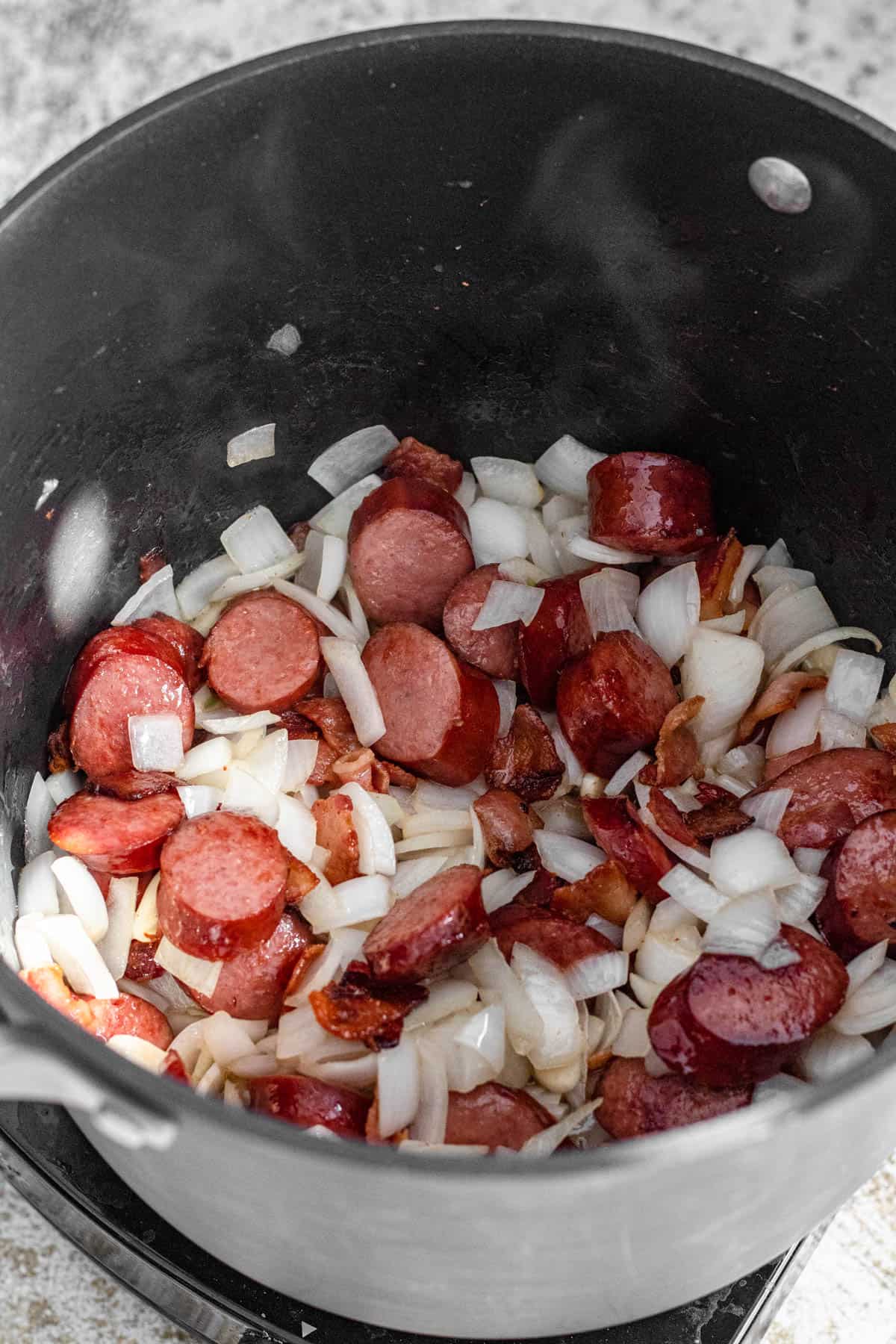 Onions and garlic added to the sausage. 