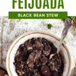 Pinterest image of a top view of a bowl of Feijoada with a spoon resting in it.