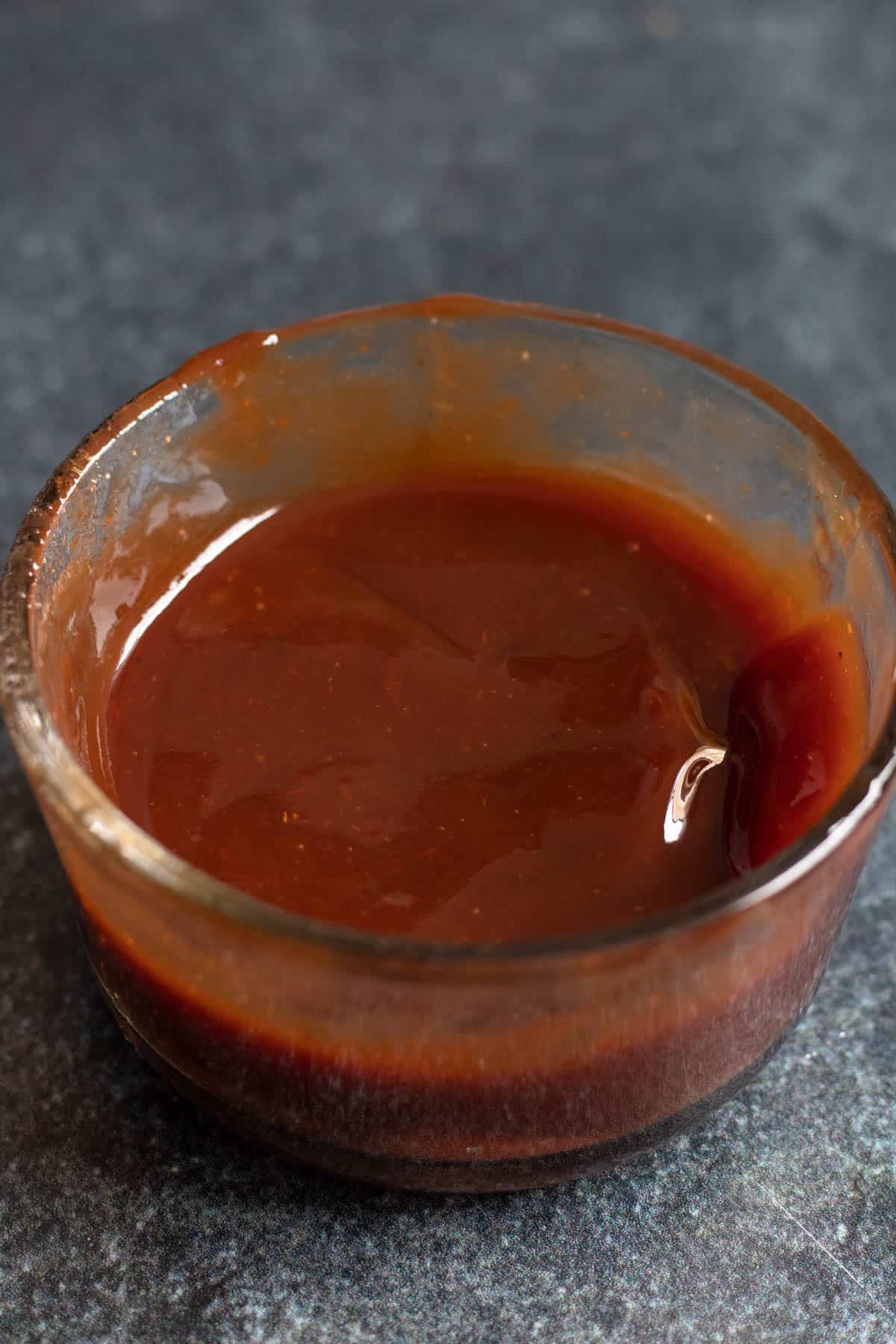 Small mixing bowl of ingredients combined to make easy katsu sauce recipe. 