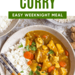 Pinterest image of a top view of a bowl with white rice and Japanese curry added to the side of it, with chopsticks resting on the side of the bowl.