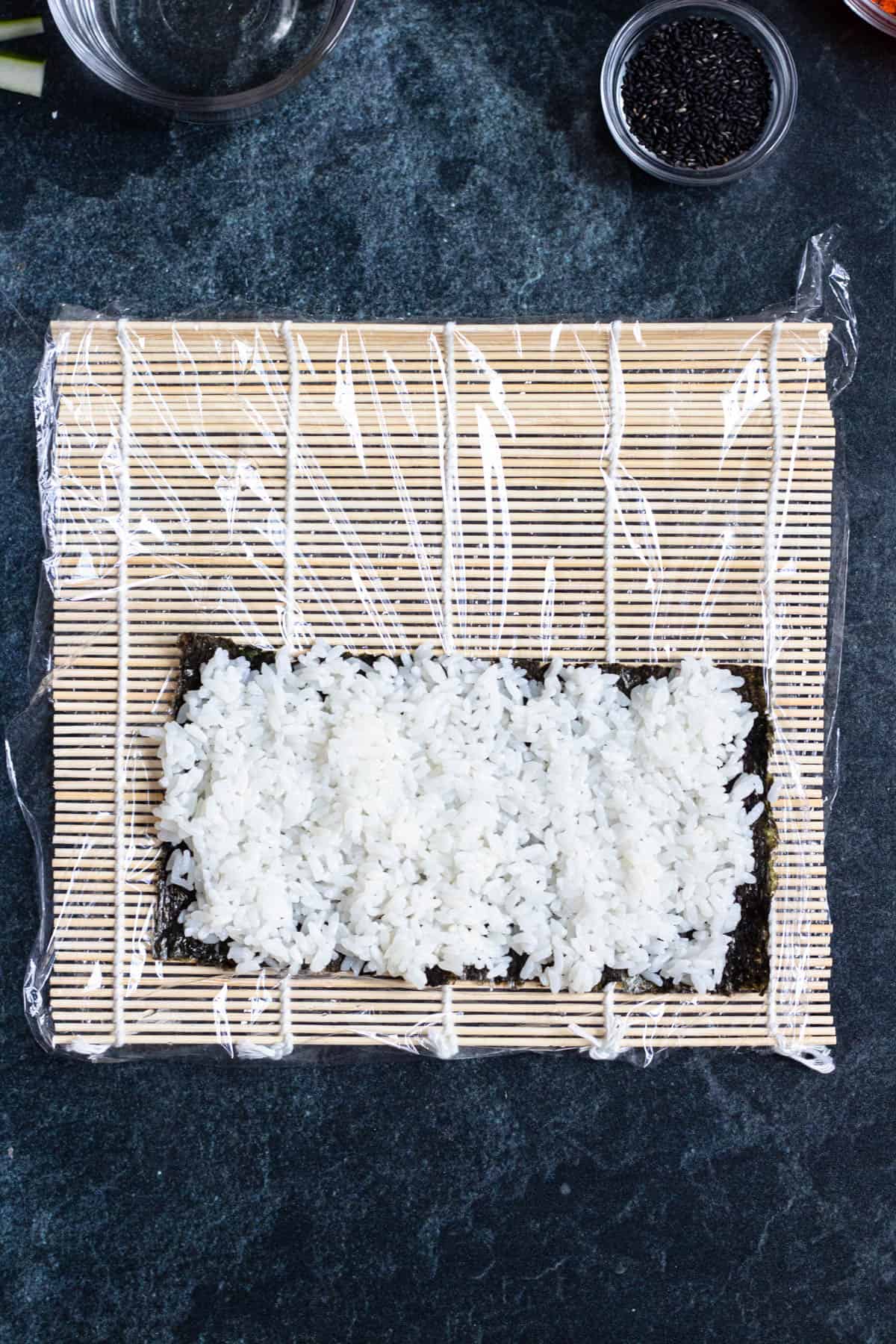 Rice covering the nori sheet.  