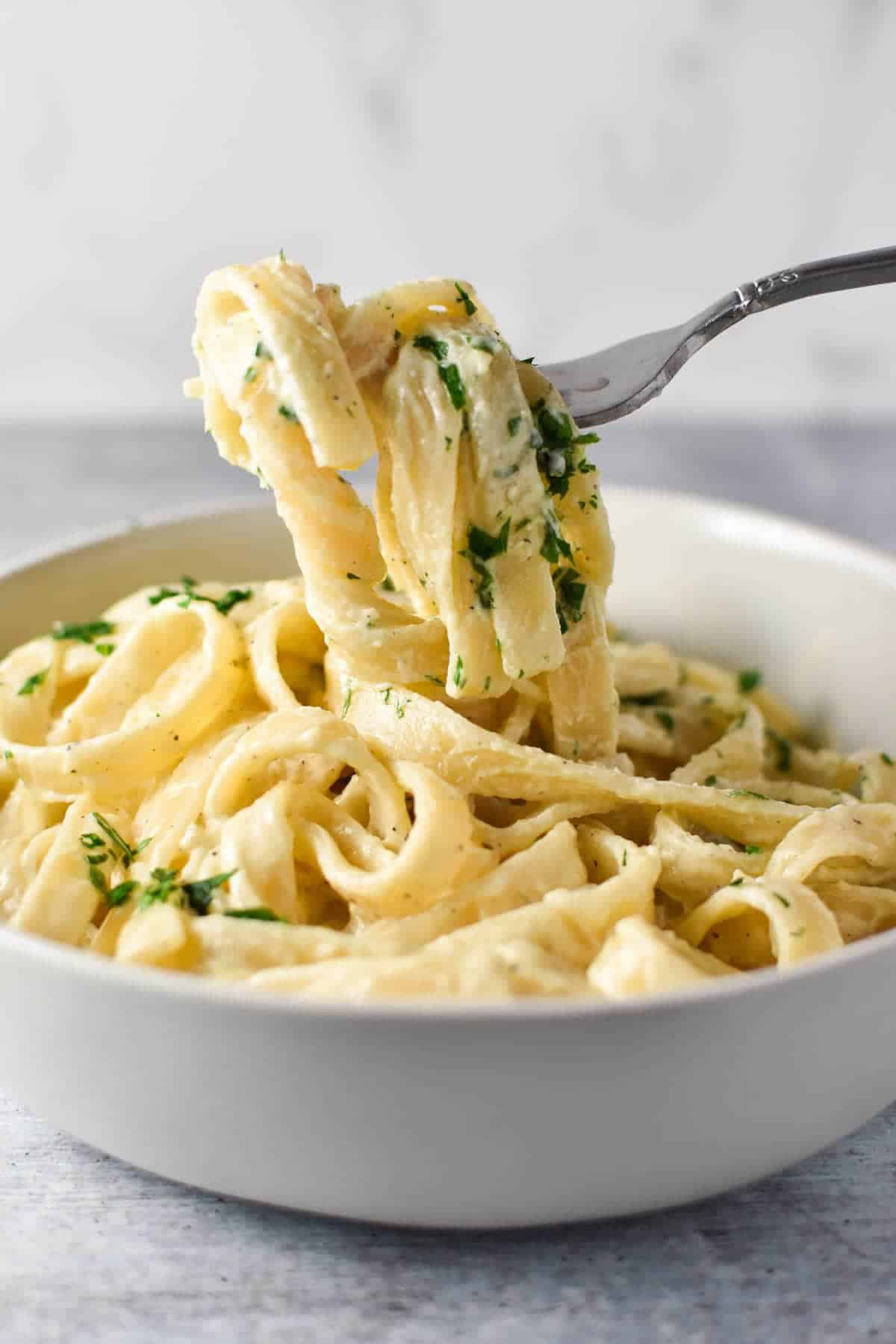 a spoon scooping up Creamy Boursin Pasta