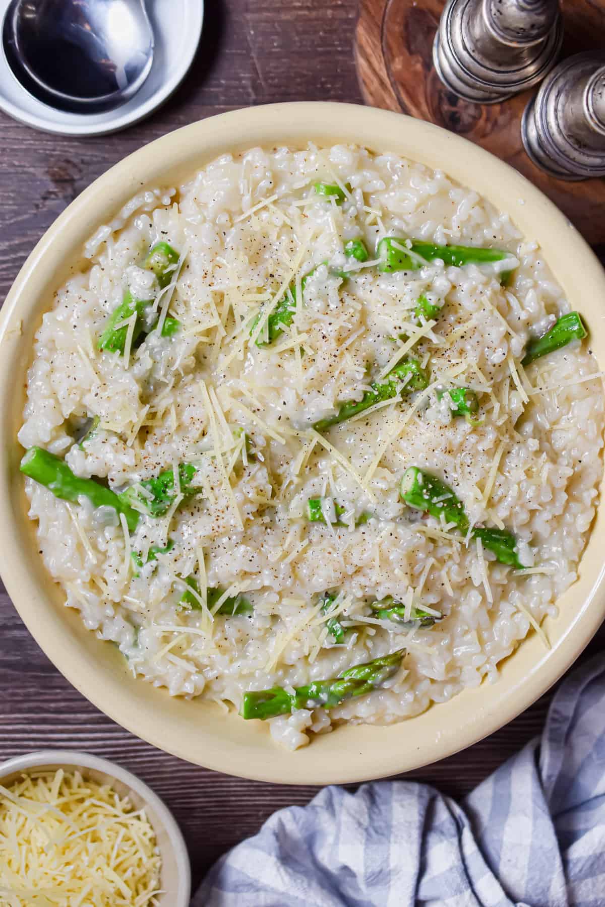 Instant Pot Asparagus Risotto topped with grated parmesan.