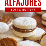 Pinterest image of a close-up shot of Alfajores Argentinos lying stacked and next to each other, with one filled with dulce de leche but not sandwiched with another cookie.